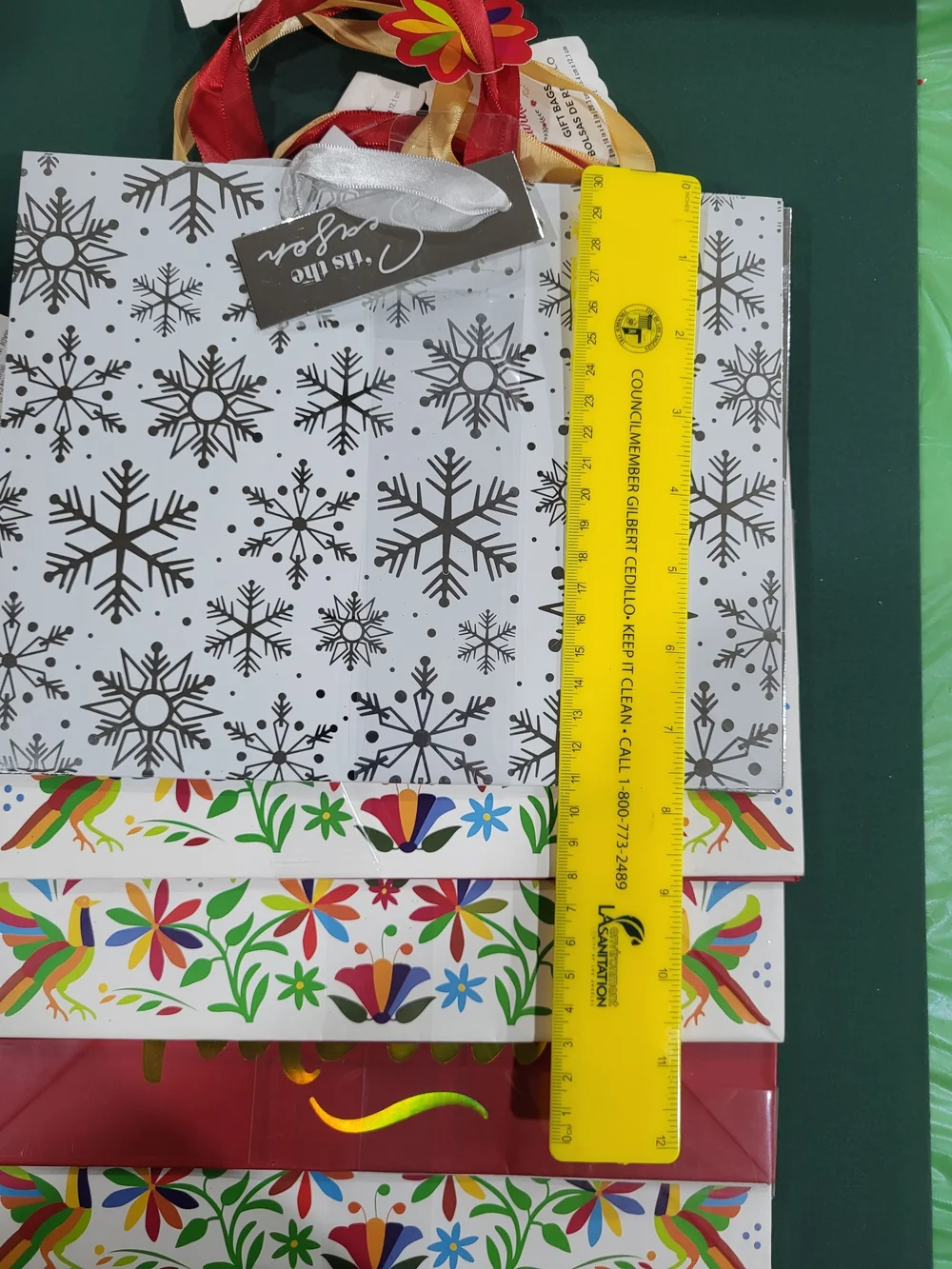 Holiday Time Feliz Navidad Red and Gold Gift Bags with Colorful Folk Art